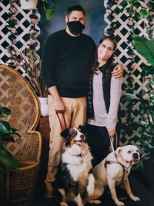 Casey and Kevin with their own dog and a foster
